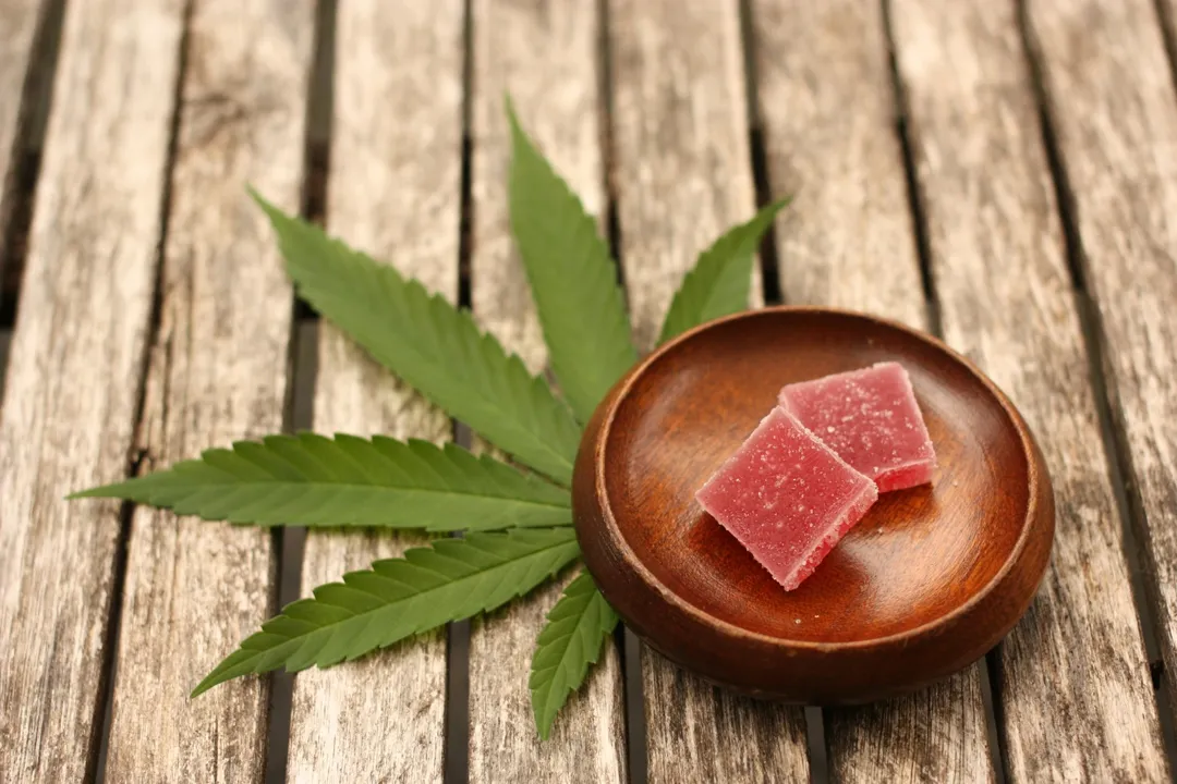 cannabis gummies on wooden plate